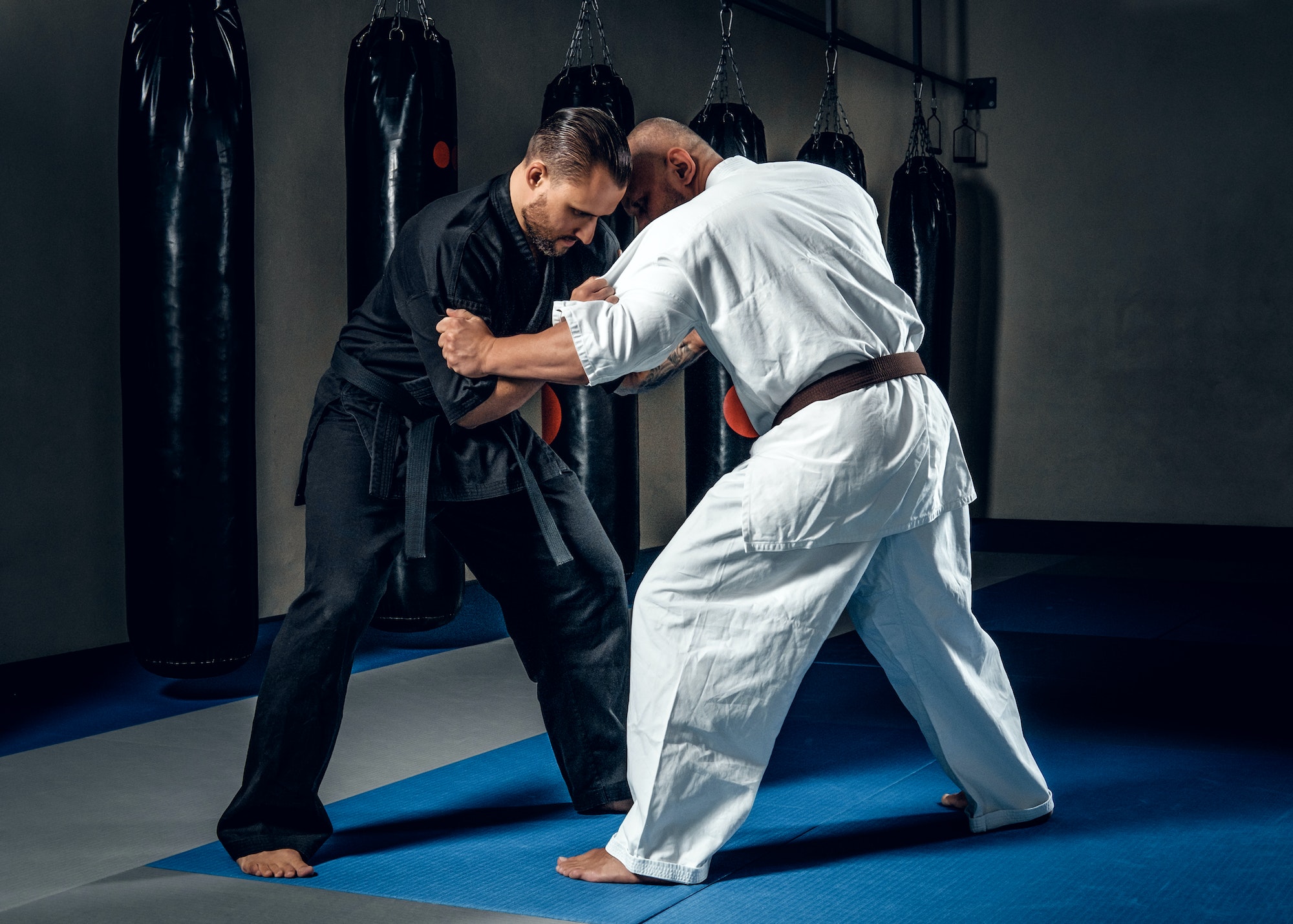 Two judo wrestlers showing their technical skills.